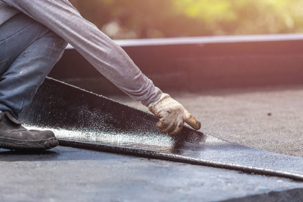 Professional Waterproofing technician working in Alto, MI